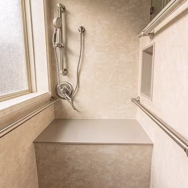 Solid-surface no-grout walls with grab bars and handshower